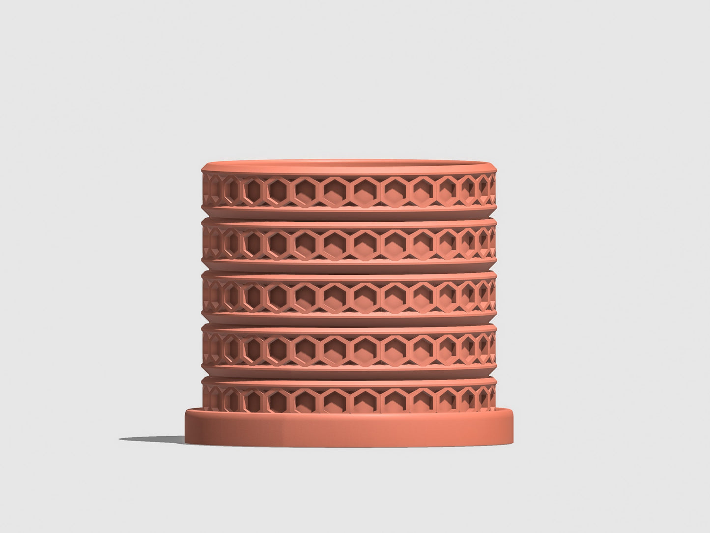 Orion hexagonal plant pot in Terracotta, front view showing geometric lattice design, light gray background