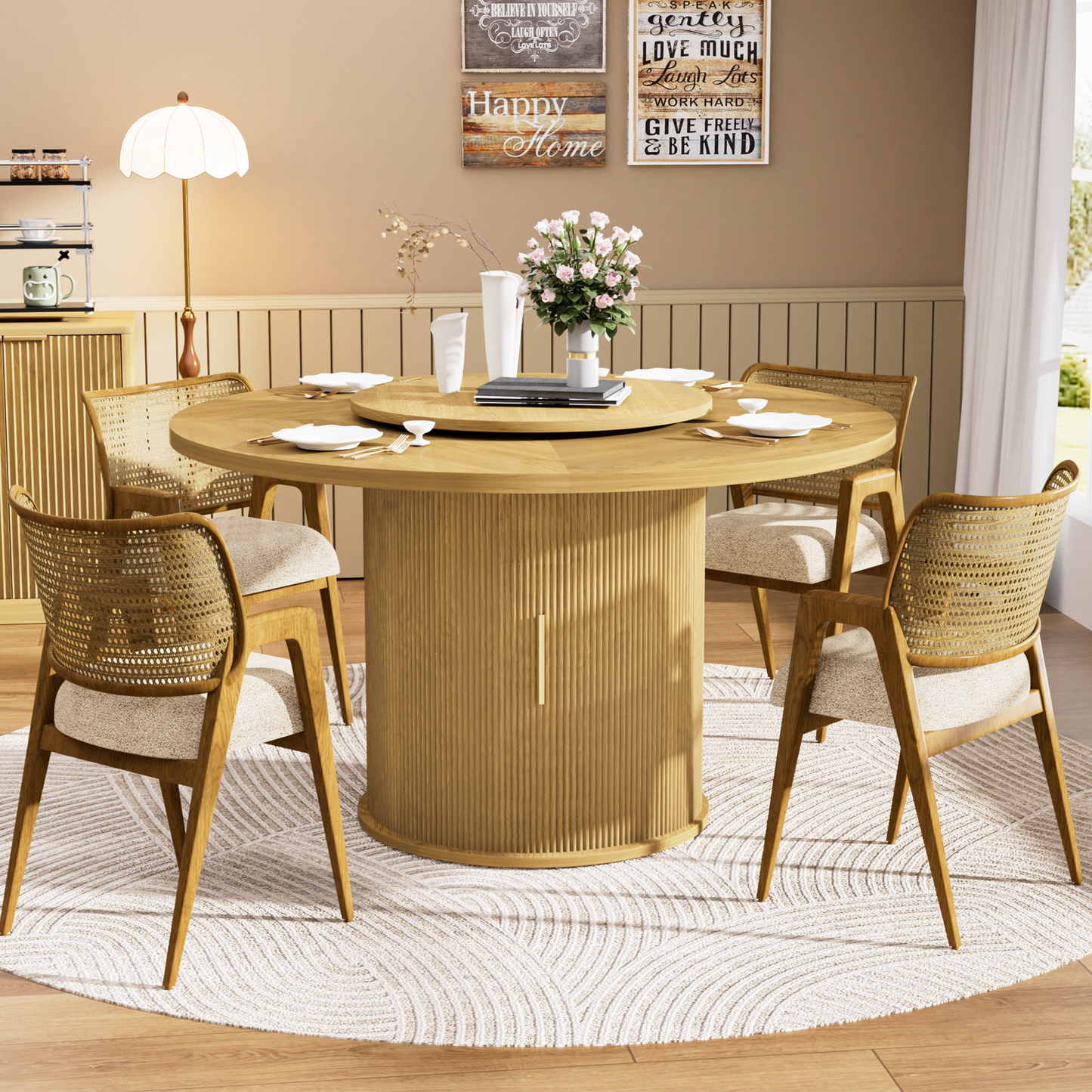 Fluent Trends 55" natural wood round dining table with storage base, rotating tray, set for six with cane chairs on a white rug.