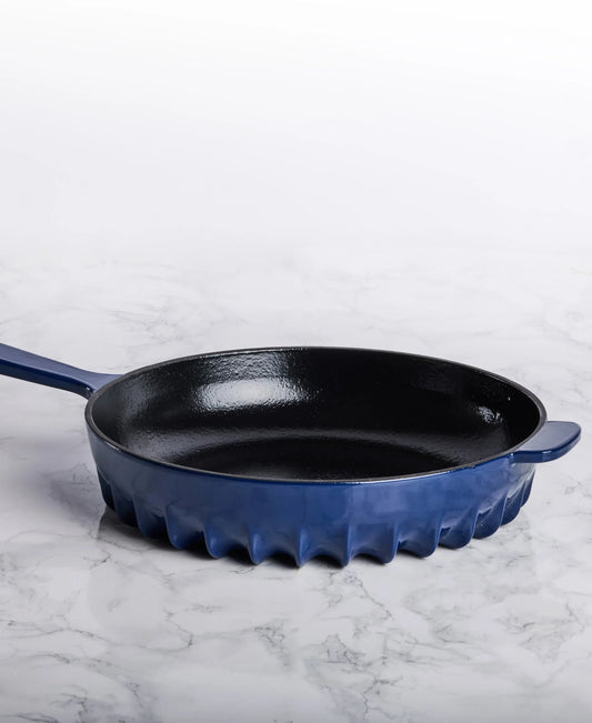 Top view of the FIREUP Oxford Blue skillet showing the matte black enamel interior and ergonomic handles.