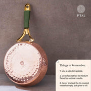 Copper frypan showing its hammered bottom, brass handle with green grip, and care instructions card. P-TAL brand logo.