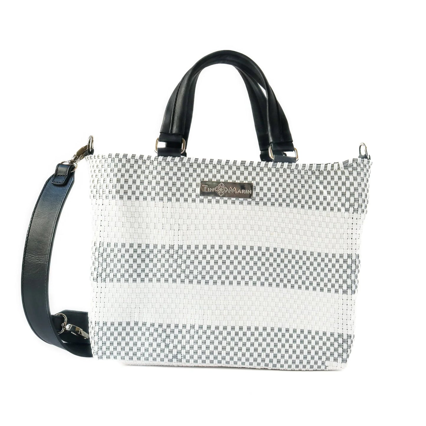 Gray and white woven tote bag with black leather handles and adjustable shoulder strap