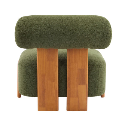 Modern green boucle lounge chair with curved wooden legs and low backrest