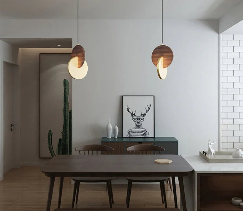 Walnut Disc Pendant light with sculptural wooden design and soft ambient glow