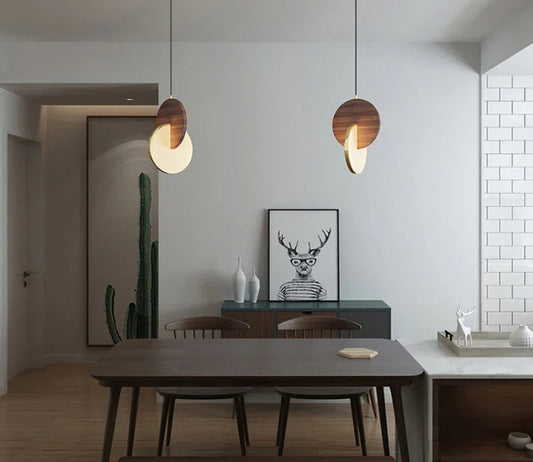 Walnut Disc Pendant light with sculptural wooden design and soft ambient glow