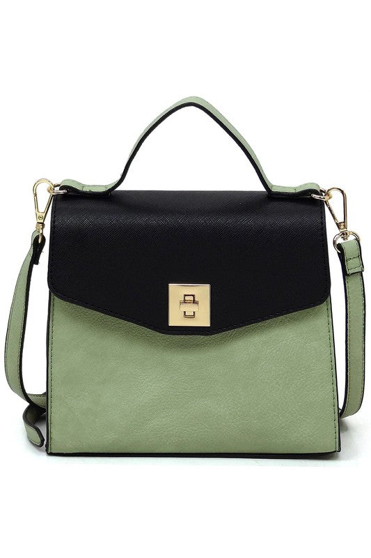 Two-tone green and black leather handbag with gold clasp and adjustable shoulder strap