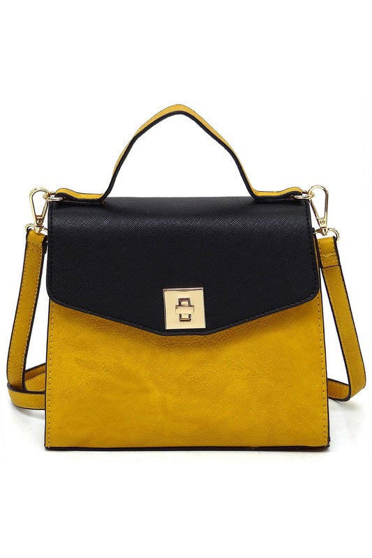 Yellow and black leather handbag with top handle and gold clasp closure on white background