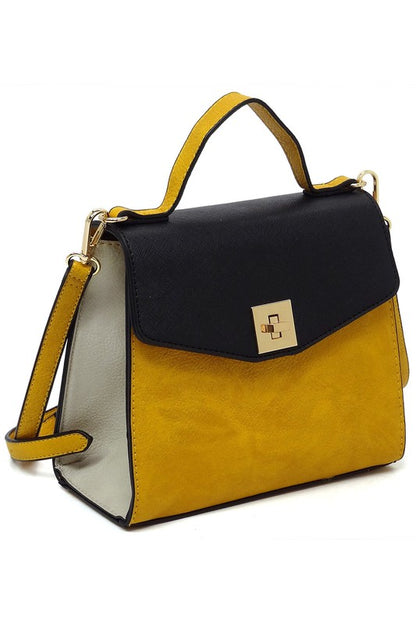 Yellow and black leather handbag with gold clasp, top handle, and adjustable shoulder strap