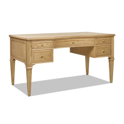 Three-quarter perspective of an ash wood executive desk showing the depth, wood grain texture, and elegant satin-gold accents.