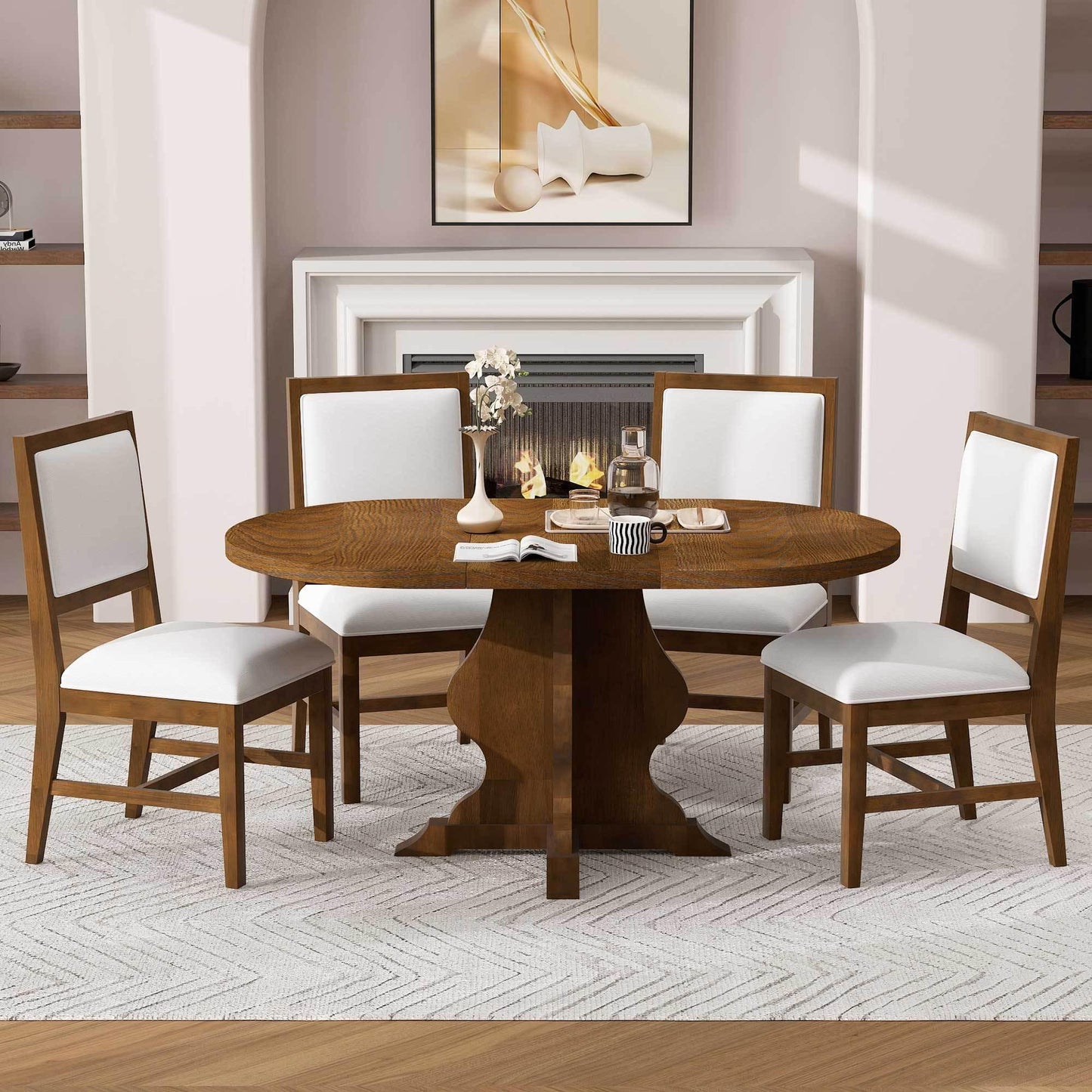 Wooden oval dining table with four white cushioned chairs in a modern dining room with fireplace