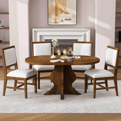 Wooden oval dining table with four white cushioned chairs in a modern dining room with fireplace