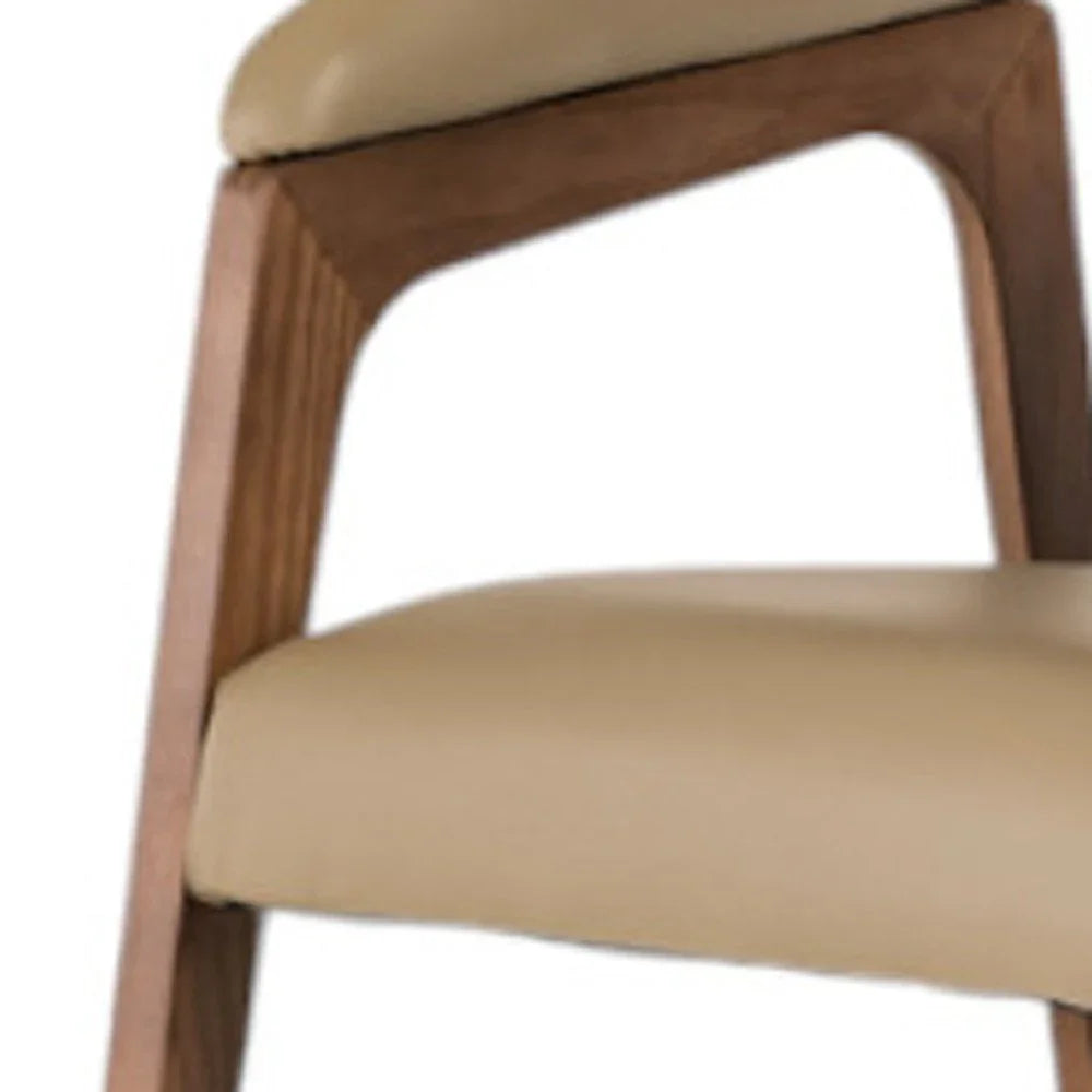 Modern beige cushioned chair with wooden frame armrest, stylish home furniture detail