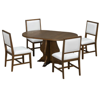 Oval wooden dining table with pedestal base and four cushioned chairs with white upholstery