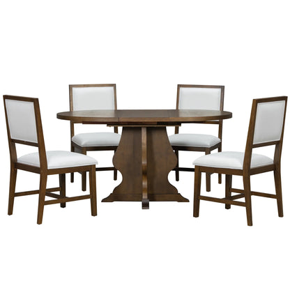 Wooden dining table with pedestal base and four matching chairs with white upholstered seats and backs