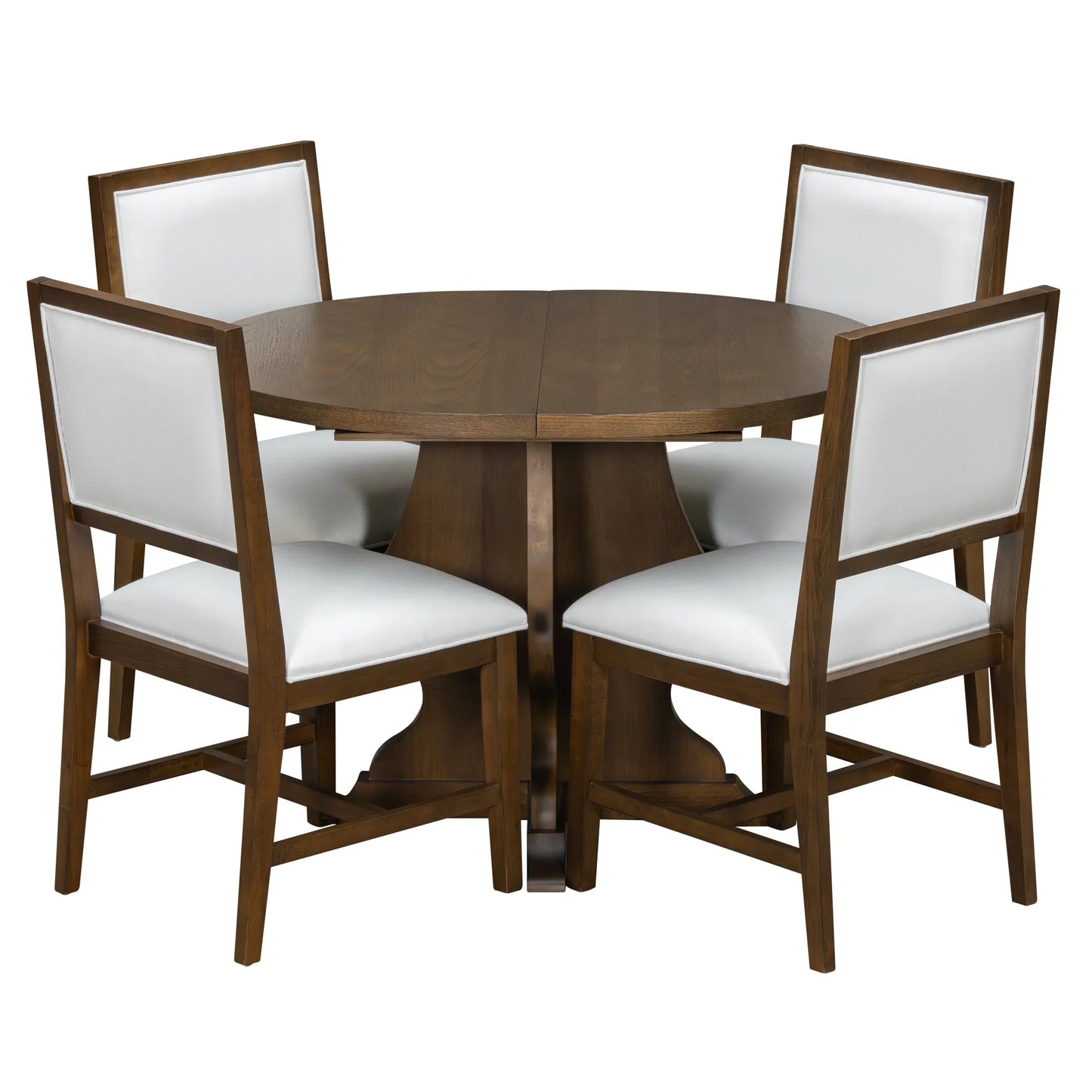 Round wooden dining table with four white upholstered chairs featuring wooden frames