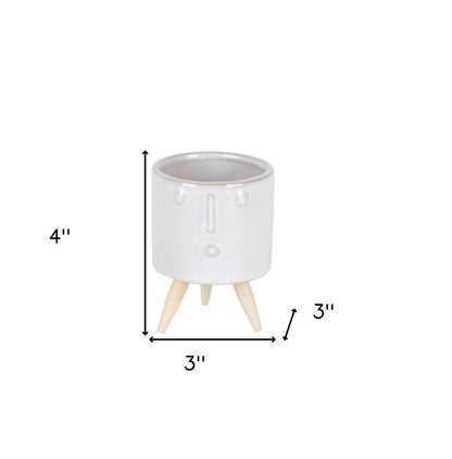 Set of Three White Porcelain 1 Ounce Round Funny Face Pot Planters With Stands HomeRoots