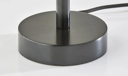 Detailed close-up of the round solid rubberwood base of the black wood table lamp featuring a smooth satin finish.