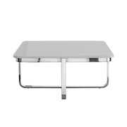 Modern square coffee table with glossy white top and chrome metal legs, minimalist design