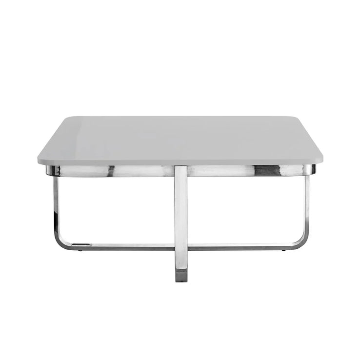 Modern square coffee table with glossy white top and chrome metal legs, minimalist design