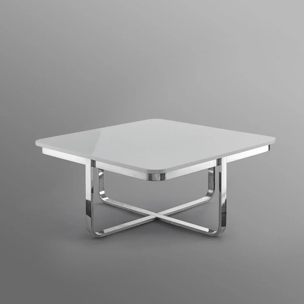 Modern square white coffee table with chrome metal crossed legs on grey background