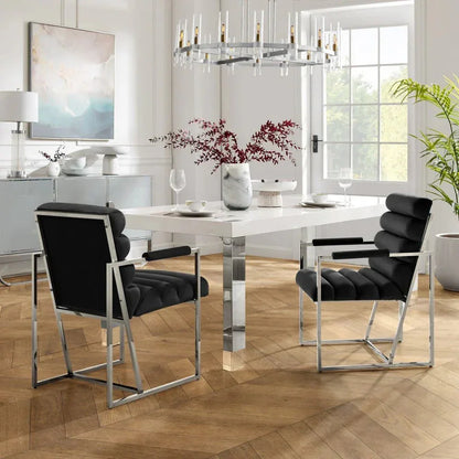 Modern dining room with black velvet chairs, white table, and contemporary decor from Fluent Trends