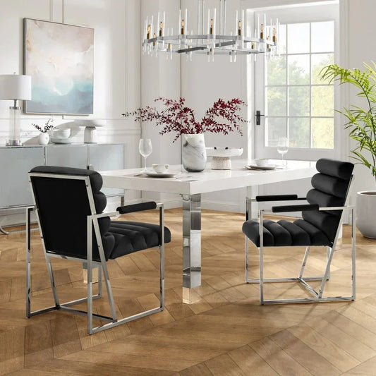 Modern dining room with black velvet chairs, white table, and contemporary decor from Fluent Trends