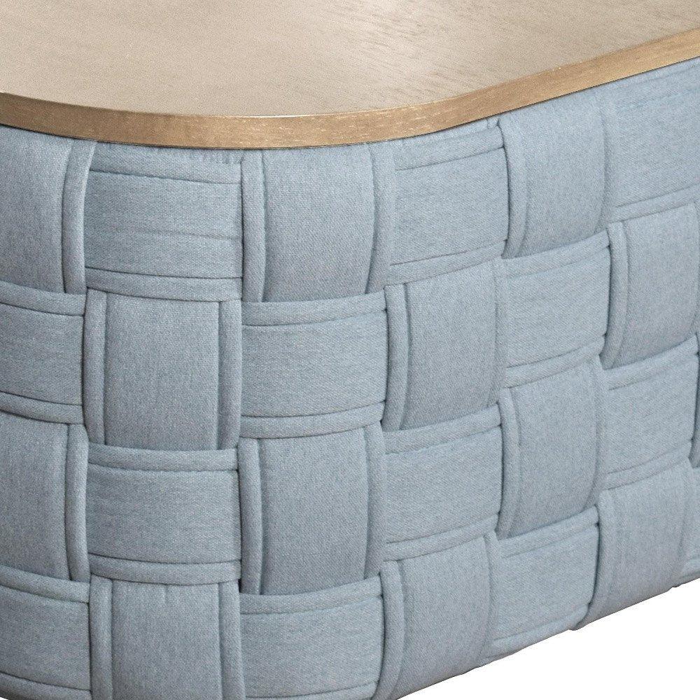 Close-up side profile of the Kinsley table highlighting the intricate natural fiber weave pattern.