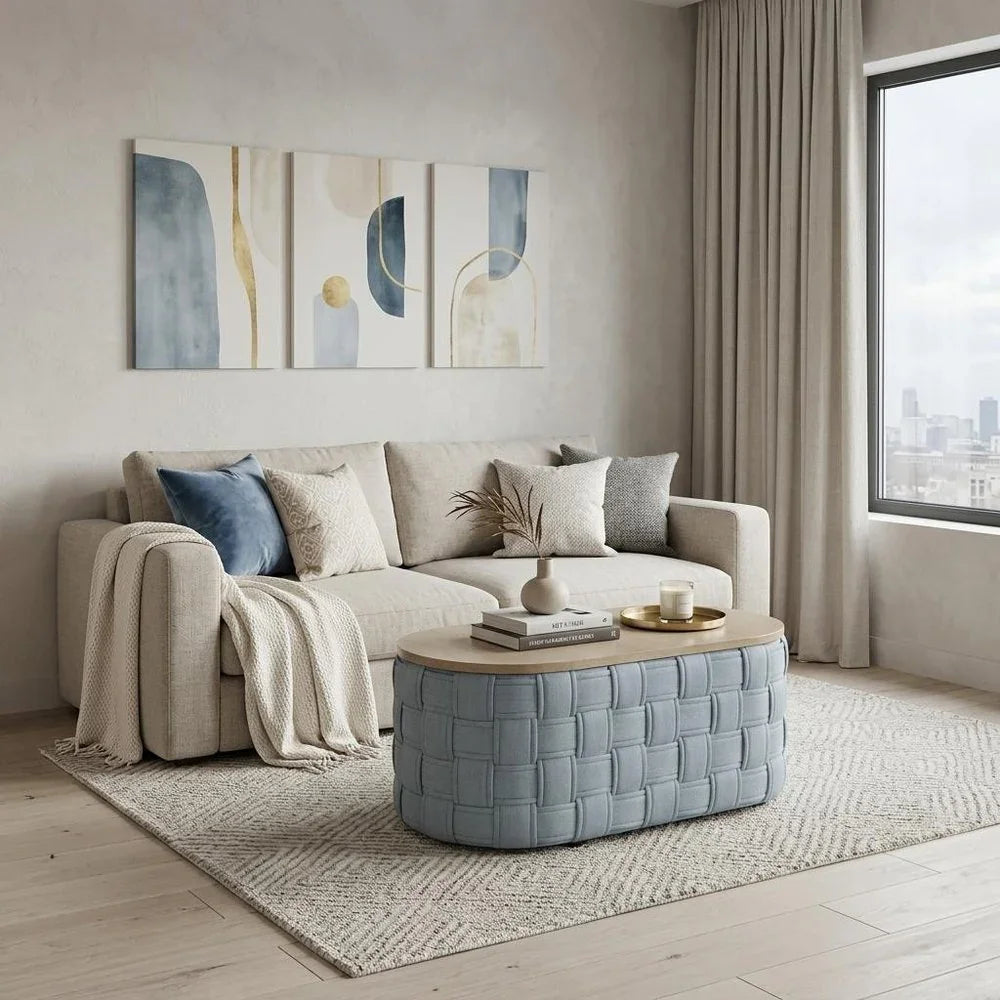 An elegant oval woven ottoman coffee table featuring a smooth wooden top surface, resting on a neutral area rug.