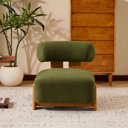 Modern olive green boucle lounge chair with wooden frame in stylish living room setting
