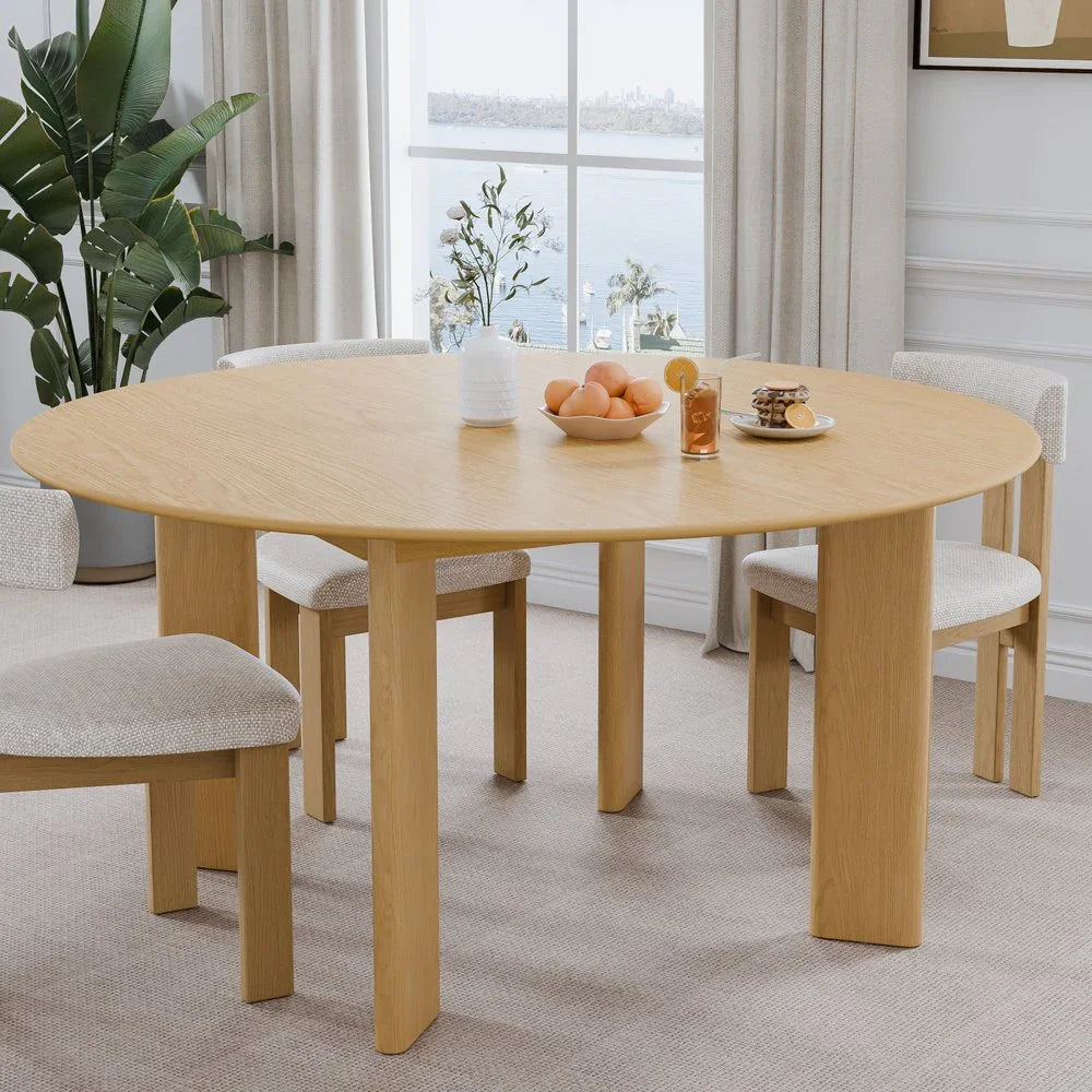 Modern light wood dining table with four cushioned chairs in a bright home interior, Fluent Trends