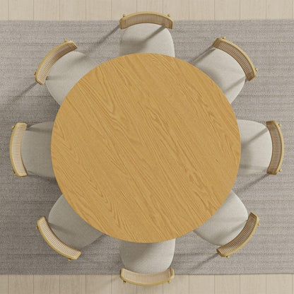 Round wooden dining table with six beige chairs on textured rug, Fluent Trends home furniture