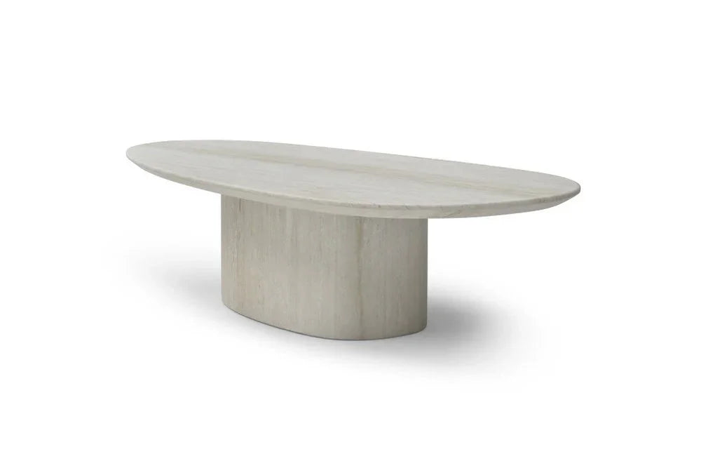 Three-quarter perspective view of the Sia 51-inch beige genuine marble coffee table highlighting the oval top and matte pedestal base.