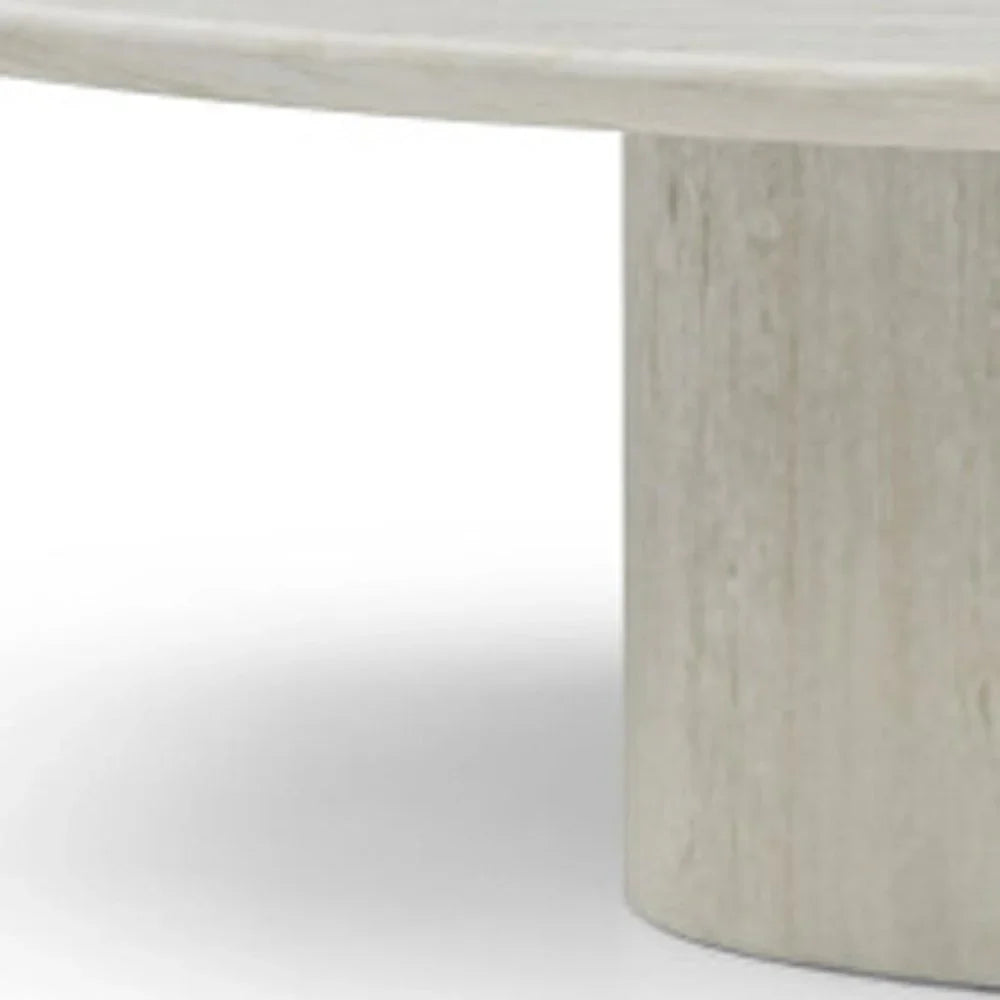 Close-up of the Sia beige genuine marble pedestal base showing the natural stone texture and matte finish.