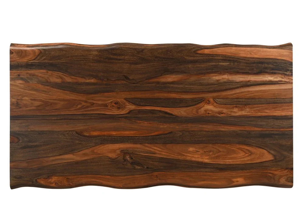 Top down view showcasing the rich dark brown grain patterns and wavy live edge of a handmade premium quality solid wood dining table top isolated on a white background