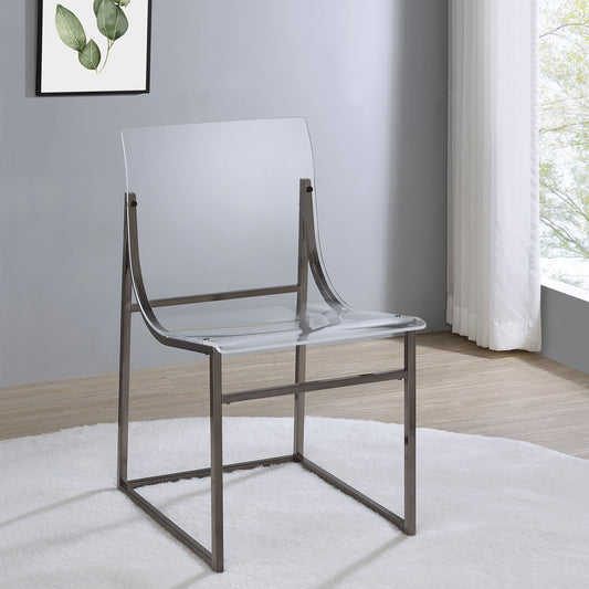 Transparent acrylic chair with metal frame on white rug in bright modern room
