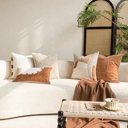 Wabi-sabi cotton-linen throw pillows in caramel and off-white arranged on a white sofa in a japandi living room