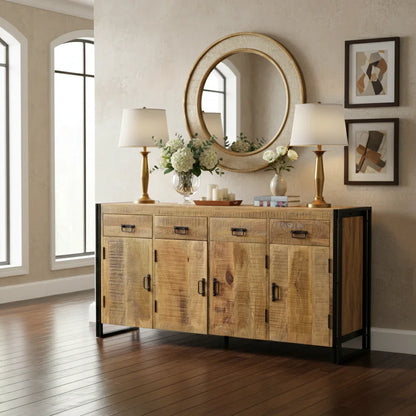 Modern living room with rustic wood sideboard, gold lamps, round mirror, and floral decor