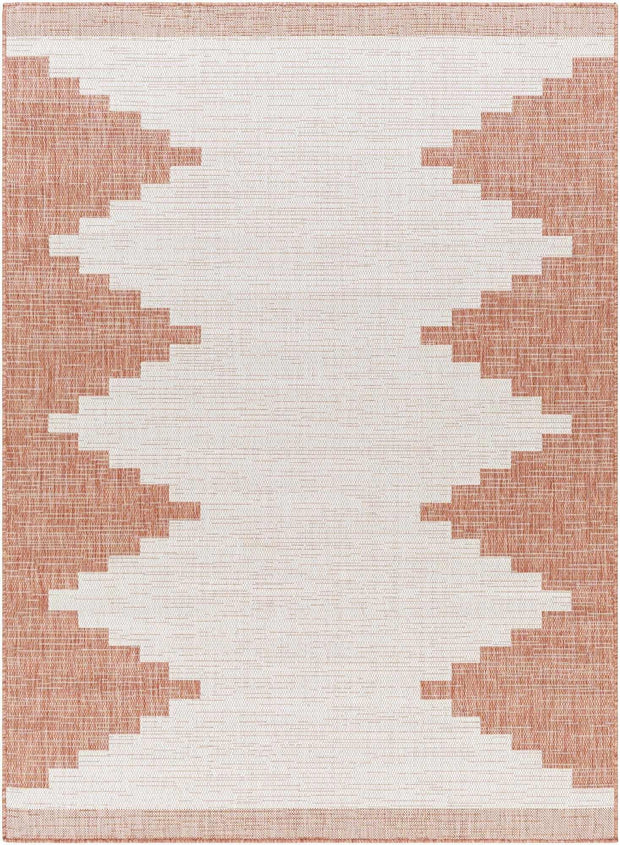 Hauteloom Djugun Peach Fuzz indoor/outdoor rug with Aztec geometric pattern in peach and white, no-pile design