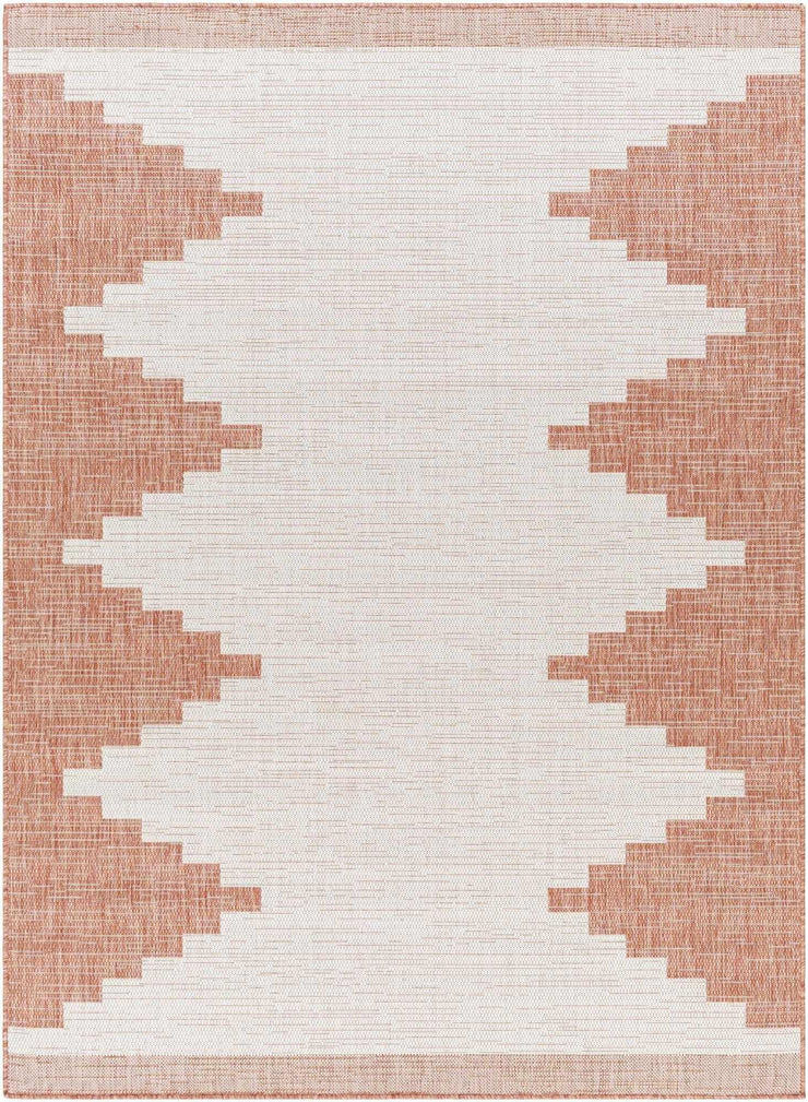 Hauteloom Djugun Peach Fuzz indoor/outdoor rug with Aztec geometric pattern in peach and white, no-pile design