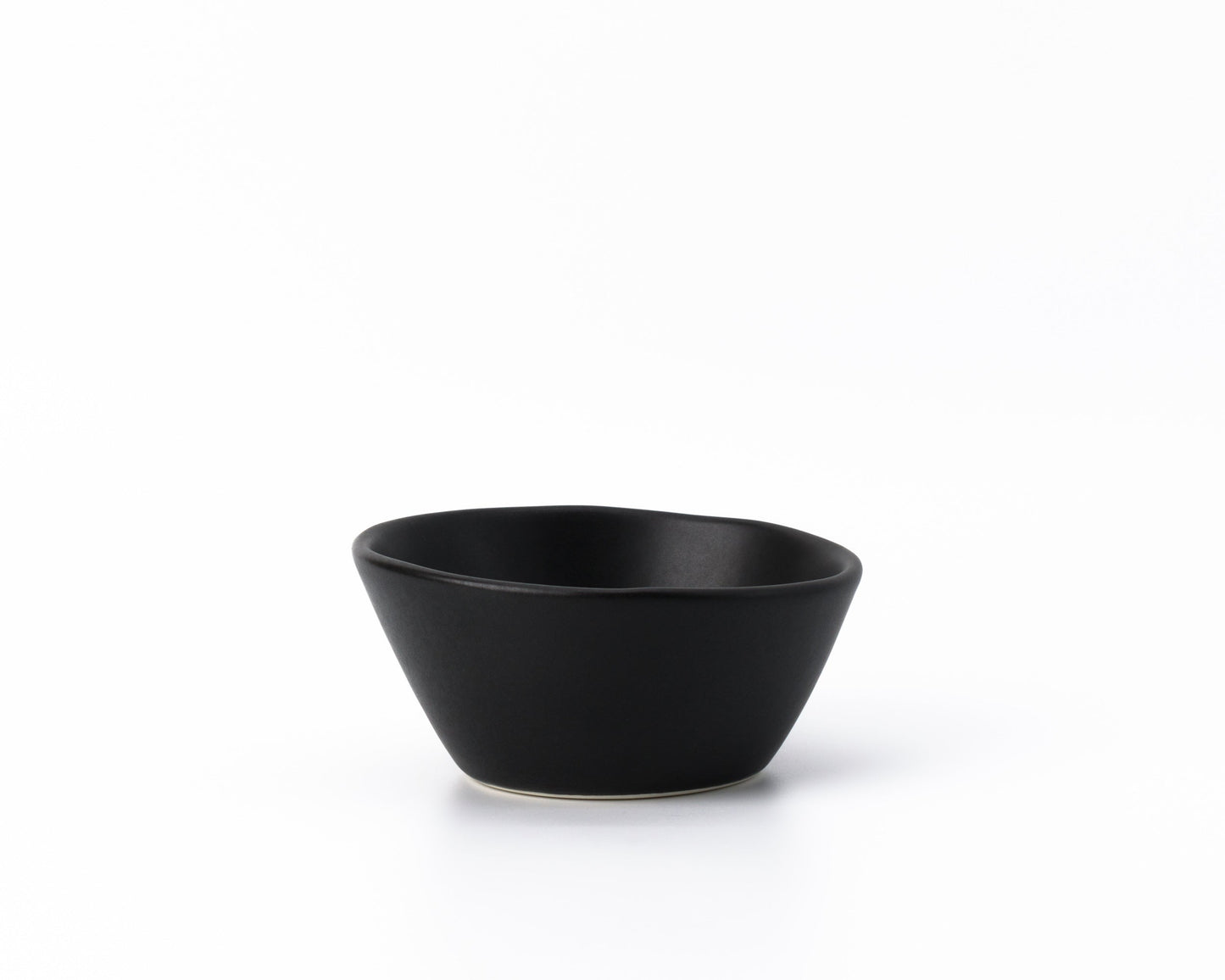 Black ceramic breakfast bowl with smooth matte finish on white background