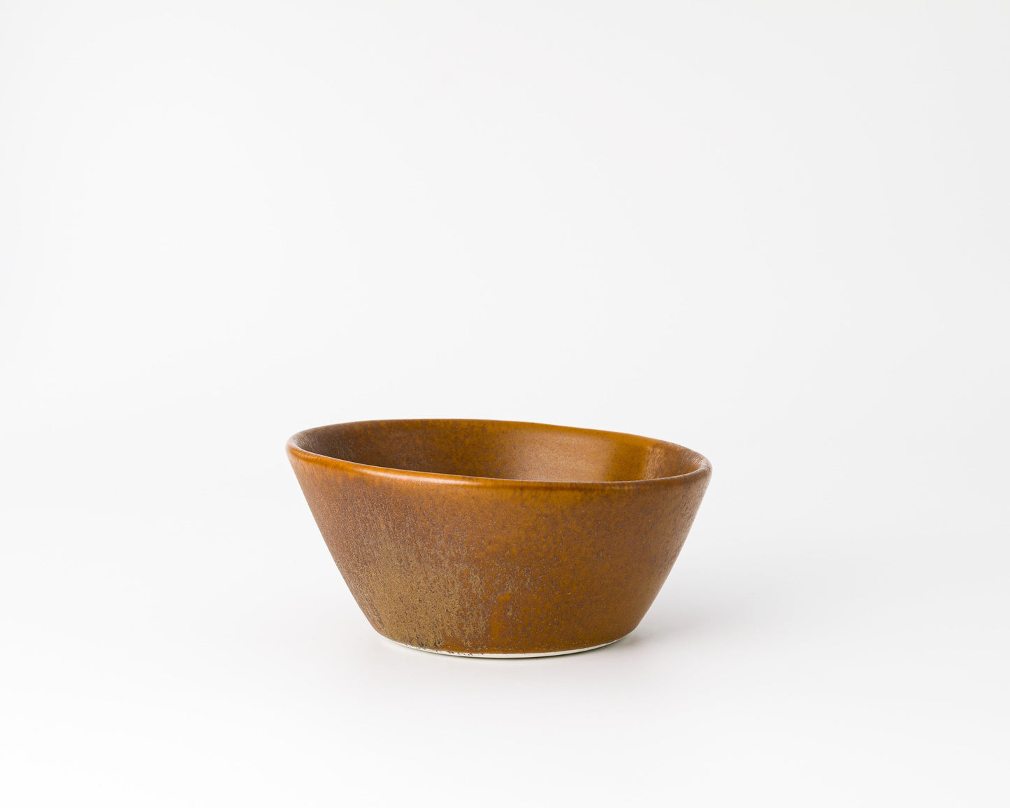 Rustic brown ceramic breakfast bowl with a matte finish on white background
