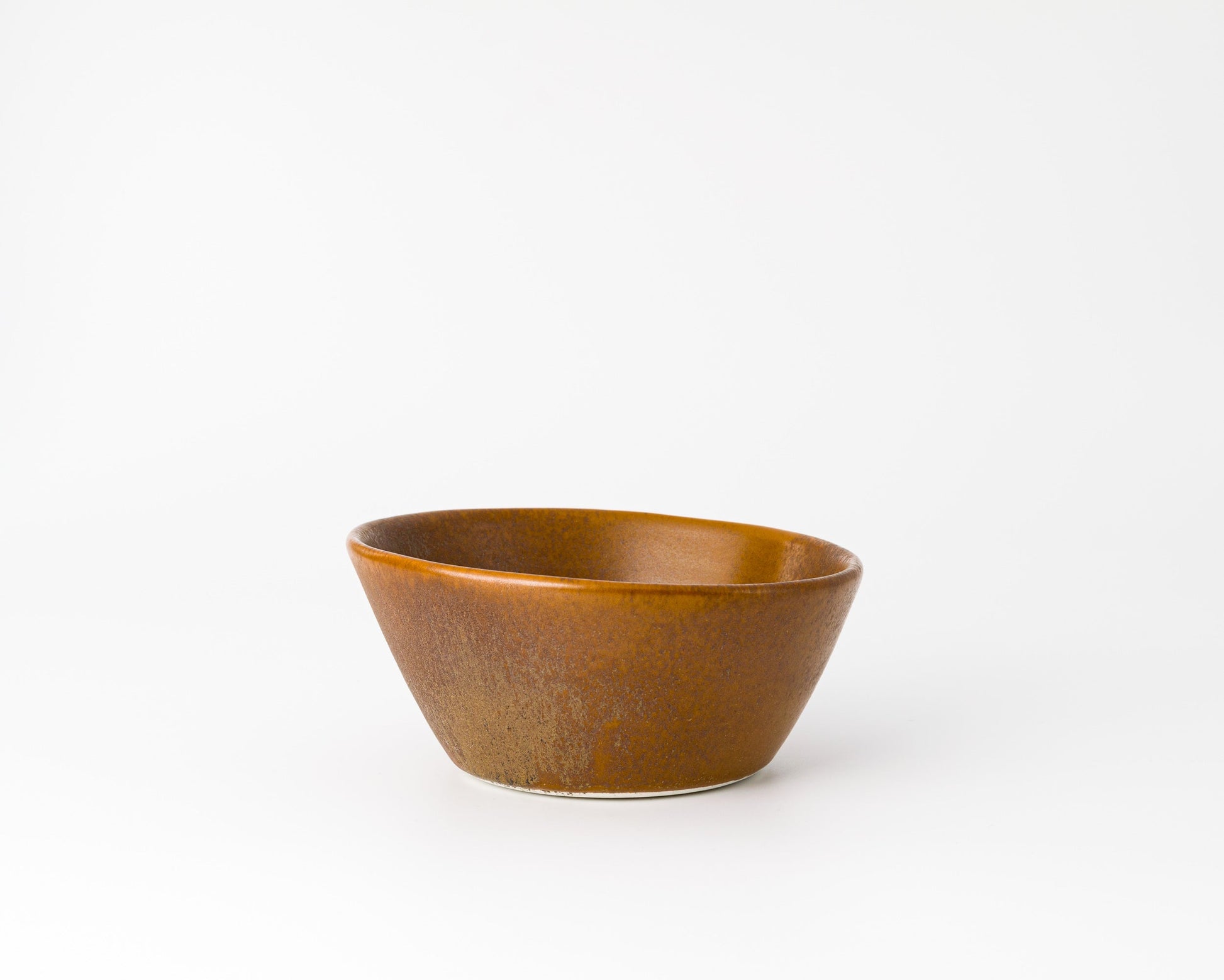 Rustic brown ceramic breakfast bowl with a matte finish on white background