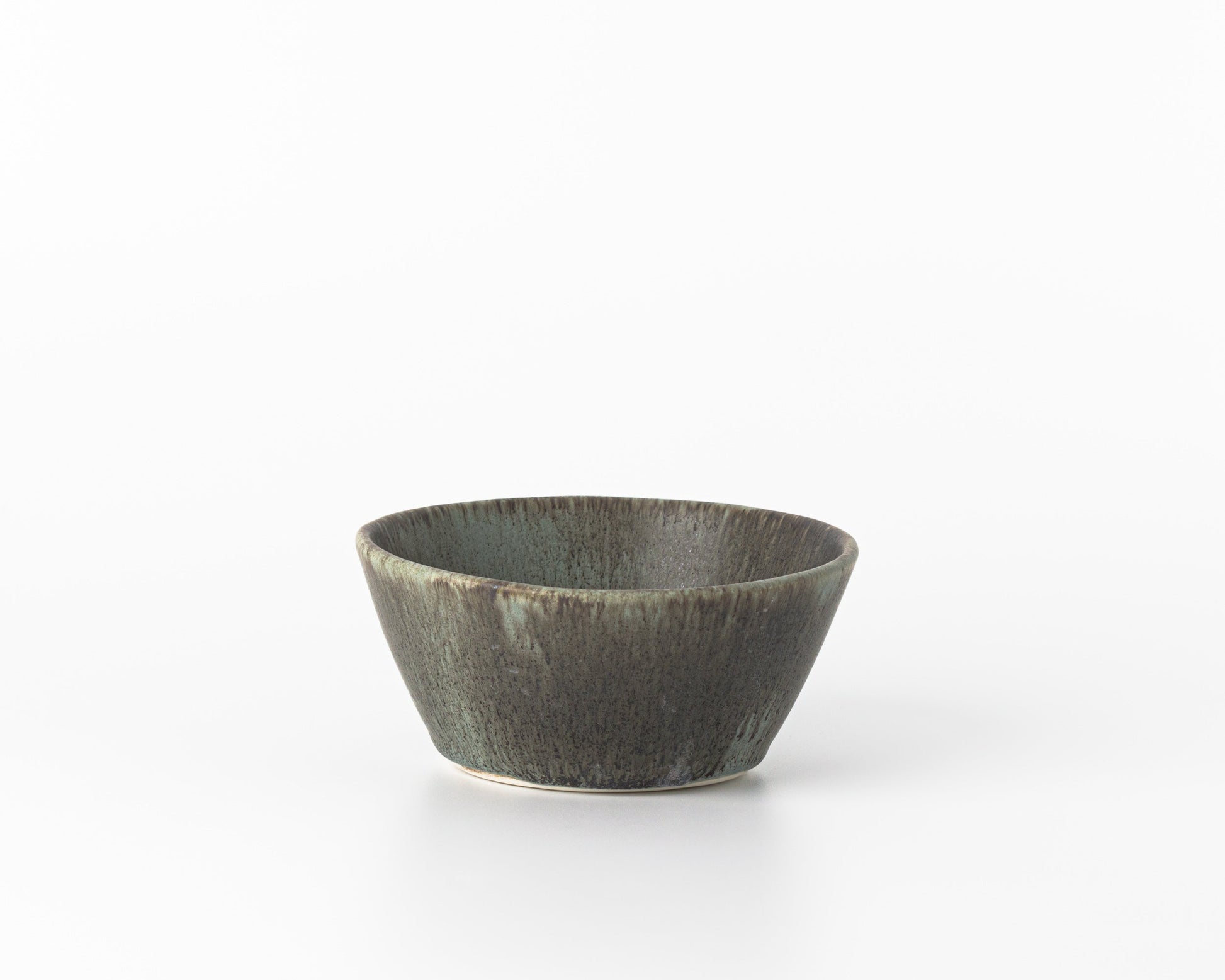 Minimalist small green concrete breakfast bowl on white background