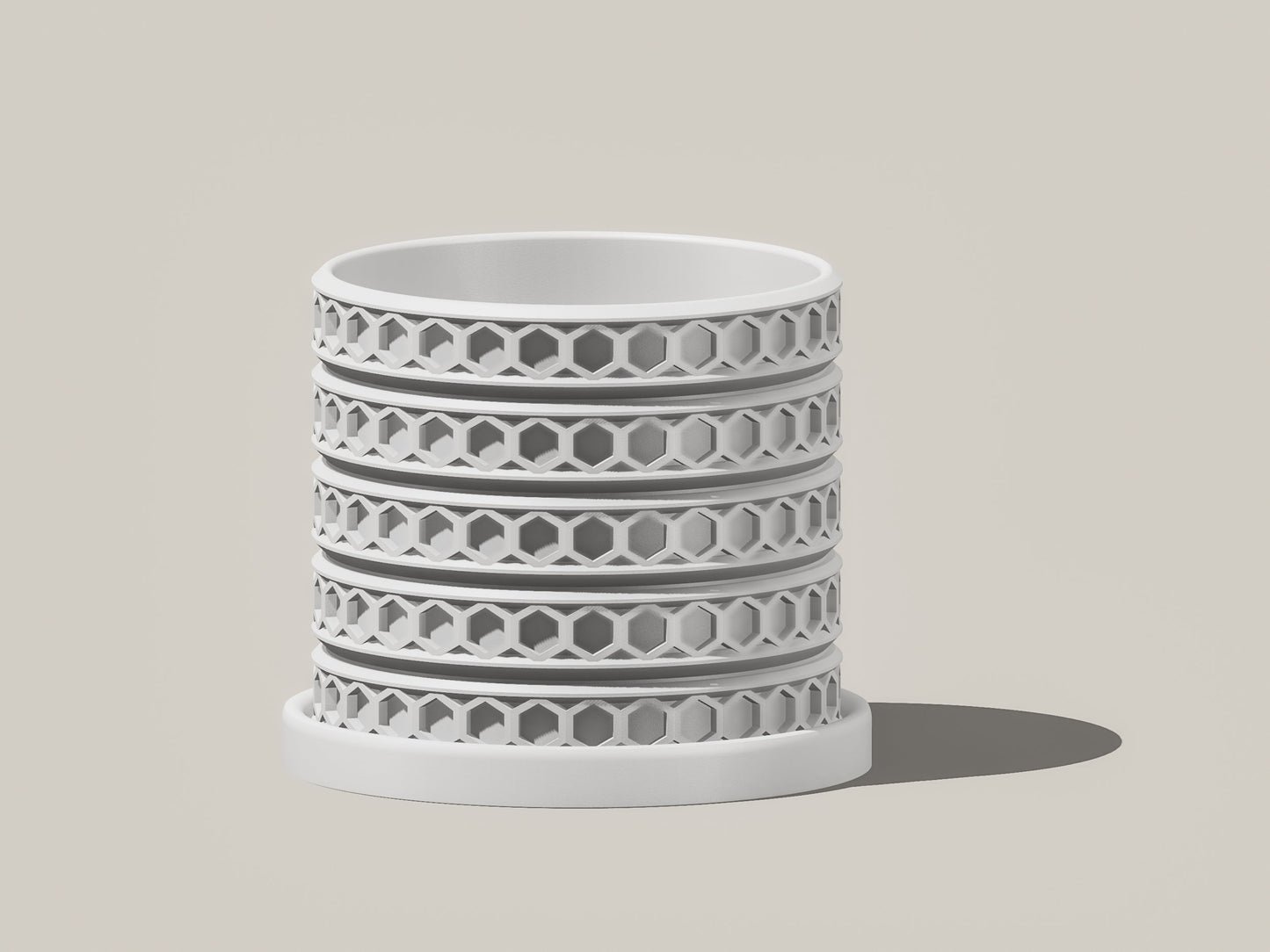 Orion hexagonal plant pot in White, front view showing geometric lattice design, light gray background