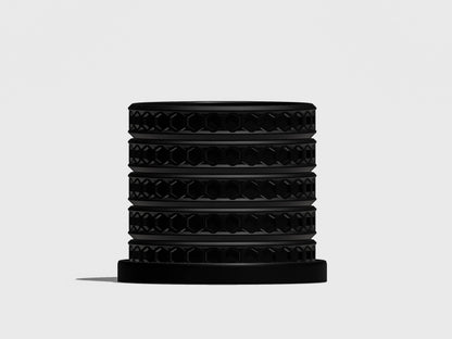 Orion hexagonal plant pot in Black, front view showing geometric lattice design, light gray background