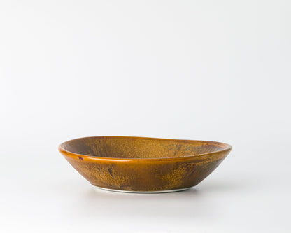 Brown rustic ceramic soup bowl on white background
