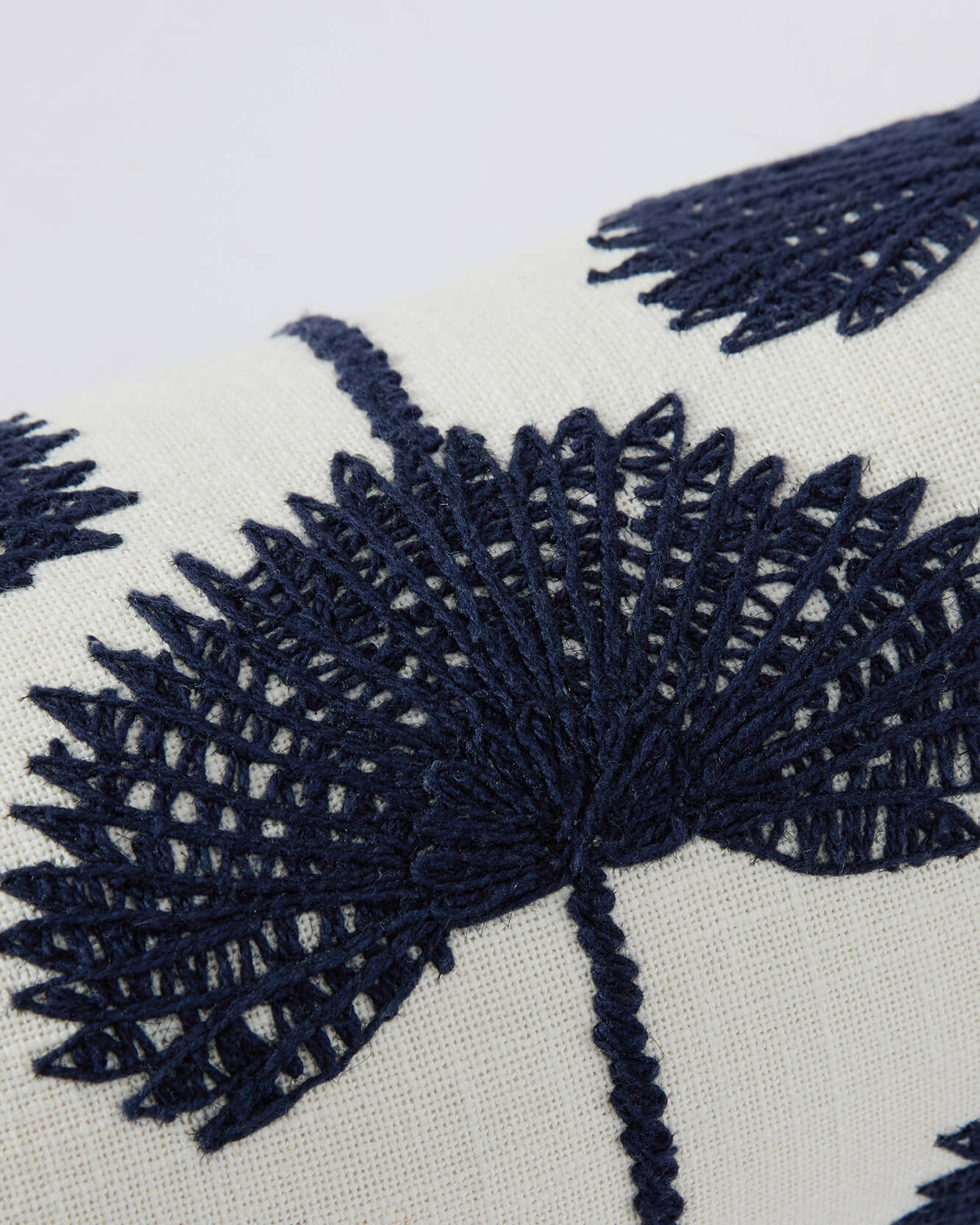Sunday Citizen Palm Leaf Embroidered Bolster Pillow Navy Off White close detail embroidery 