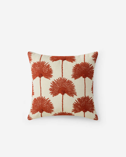Off white throw pillow with sienna rust embroidered palm leaf botanical repeat pattern on white background
