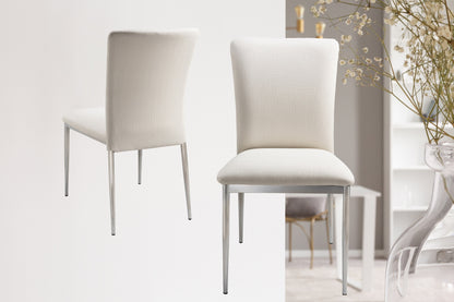 Modern white upholstered dining chairs with metal legs placed in a bright minimalistic room