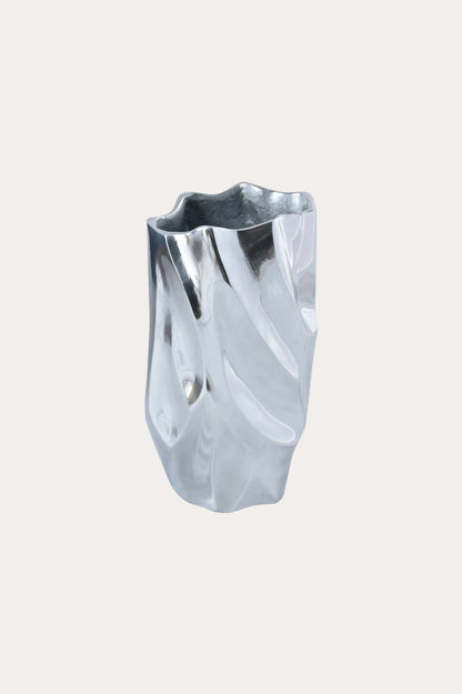 abstract-silver-aluminum-vase-with-fluid-sculptural-folds-polished-finish-cream-background