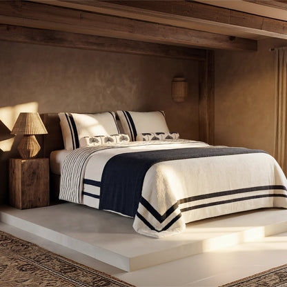 Amarena Snug Striped Sham Set in warm bedroom setting with coordinating striped comforter 